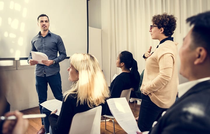 Business employees working together on their salary company tutorial